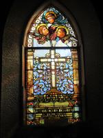 Chrystie Memorial Window: ornamental with cross and angel faces Chrystie Memorial Window: ornamental with cross and angel faces