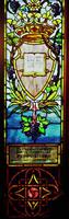 Brown Memorial Window: a shield containing an open book, surmounted with a jeweled crown, and wrapped in a scrolling grape vine Brown Memorial Window: a shield containing an open book, surmounted with a jeweled crown, and wrapped in a scrolling grape vine