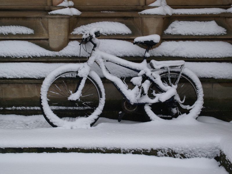 snow covered bicycle, St John's, Cambridge, England