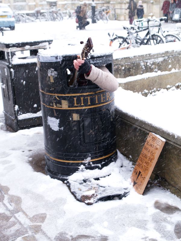 playing guitar in a litter / trash bin in the snow (crazy times two), Cambridge, England