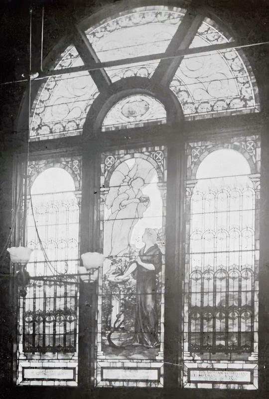 Willard Memorial Window:  woman with her hand resting on the dial of time, in the act of annunciating a truth, above her is a messenger of God, benigning blessings upon her for her life's acts and words