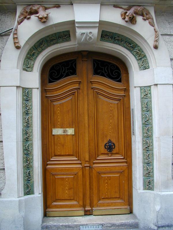 Paris, France: 78 Rue Mademoiselle: door (with cat and dog, and lizard tiles; architect A.M. Turin, tiles by A. Bigot)