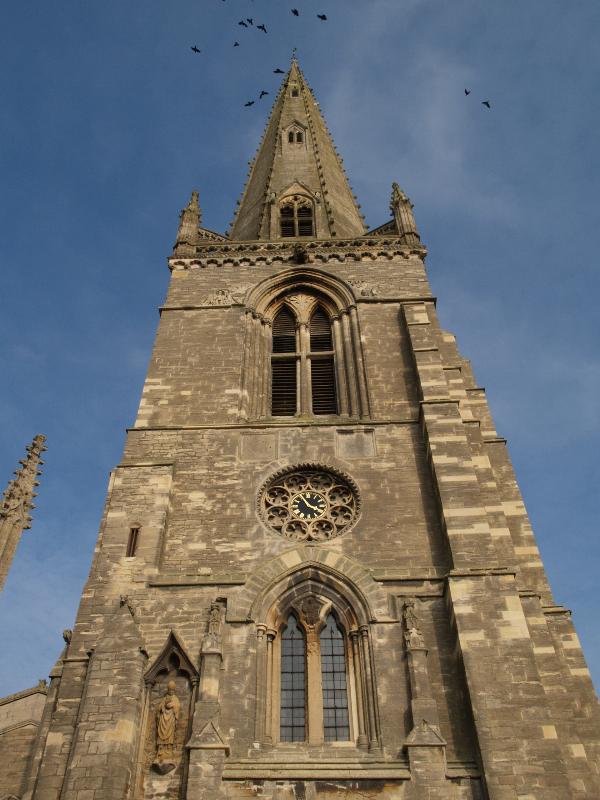 Higham Ferrers, England: Parish Church of St Mary the Virgin: tower and spire (with birds)