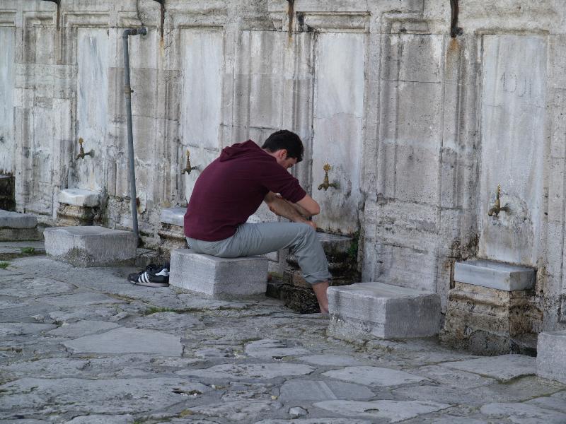 Istanbul, Turkey: Suleymaniye Camii (Mosque): man washing before prayer