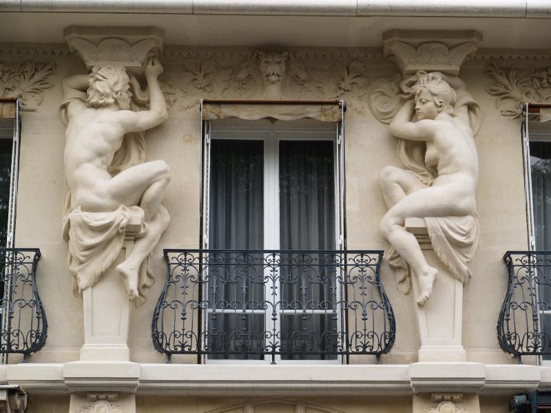 Paris, France: 148 Rue de Grenelle: caryatids surrounding window