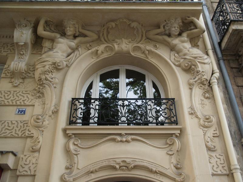 Paris, France: 177 Rue d'Alesia: caryatids surrounding window (1899, Denisson, Fils, sculptor M. Rouilliere)