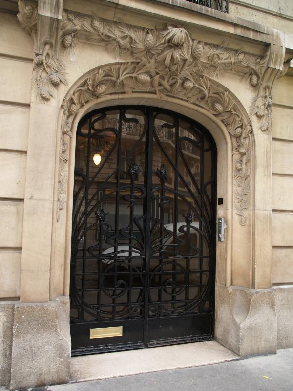 Paris, France: 5 Rue Valentin Hauy: door with pine tree motif (1905, architect H. Cadilhac, sculptor Anciaux)