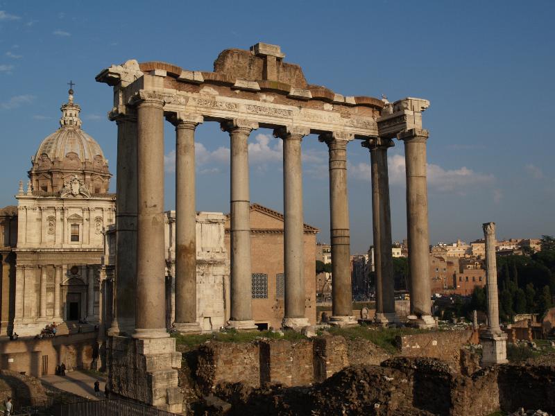 Rome, Italy: Tempio di Saturno (Temple of Saturn): view (columns date from 4th century) (with view of Santi Luca e Martina at left and Colonna di Foca at right)
