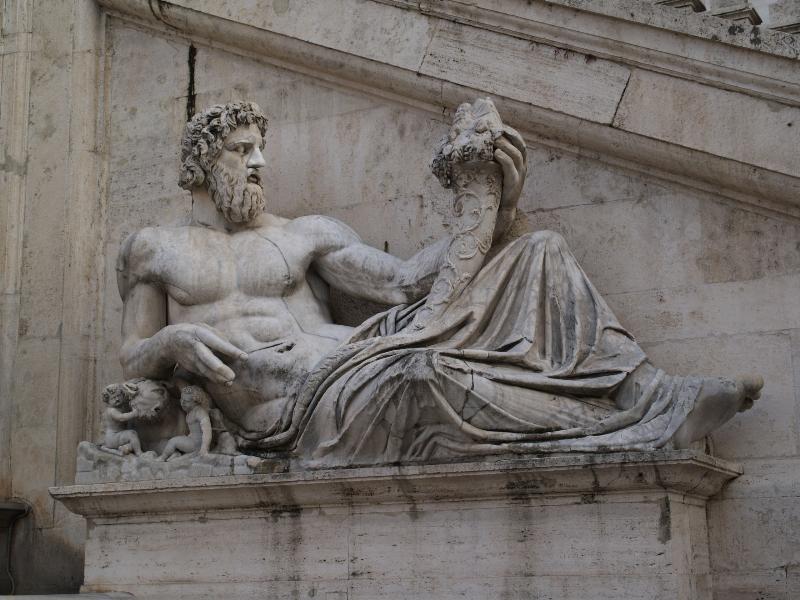 Rome, Italy: Palazzo Senatorio: sculpture representing the Tiber (was the Tigris but tiger's head was replaced by wolf's head) (from Constantine's bath on the Quirnal)