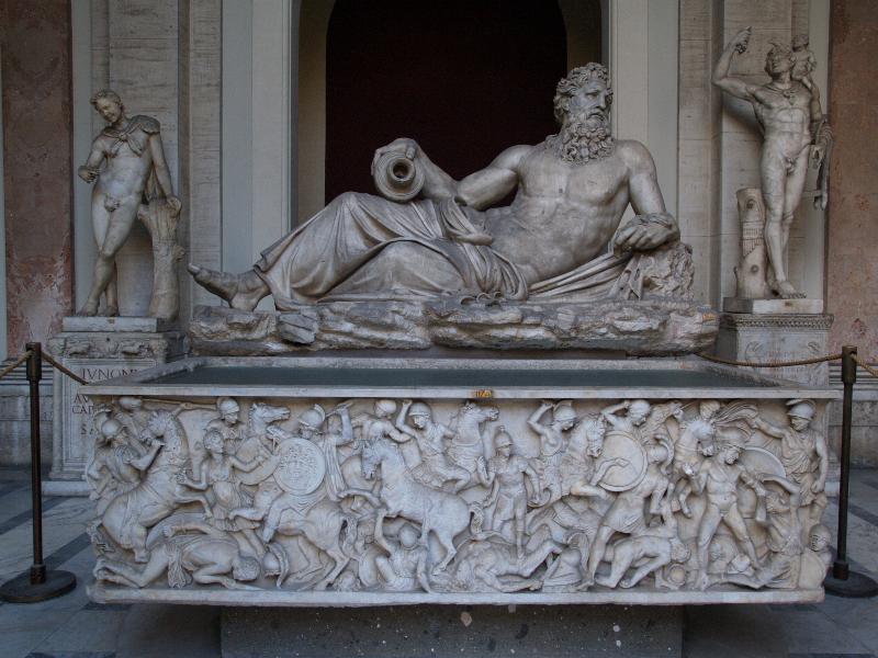 Vatican City: Vatican Museum: reclining figure and sarcophagus with battle scene (Cortile ottagonale del Belvedere, Octagonal Court of Belvedere)
