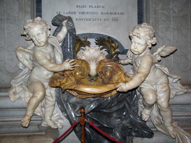 Vatican City: Basilica di San Pietro (St Peter's Basilica): holy water stoup, with angels