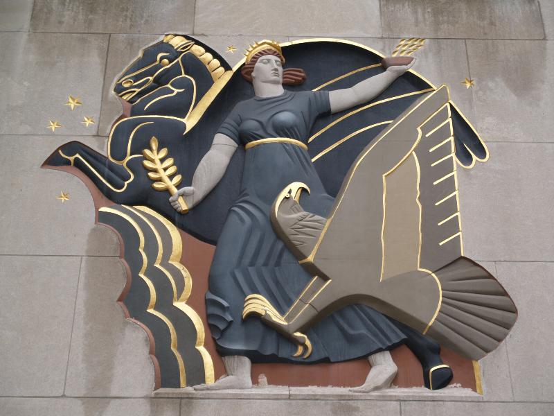 New York City, NY: 14 West 49th Street (One Rockefeller Plaza, Rockefeller Center): 'Progress' (decoration above door) (art deco, 1937, Lee Lawrie, colorist Leon V. Solon)