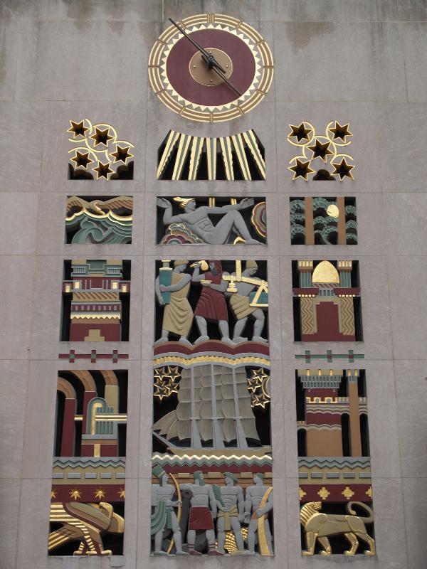New York City, NY: 45 Rockefeller Plaza (International Building, Rockefeller Center): 'The Purpose of the International Building' (or 'The Story of Man') (wall decoration above door) (art deco, 1935, Lee Lawrie, colorist Leon V. Solon)