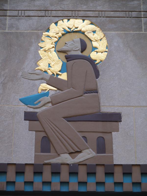 New York City, NY: 9 West 50th Street (International Building, Rockefeller Center): 'St Francis of Assisi with Birds' (decoration over door) (1935, Lee Lawrie, colorist Leon V. Solon)