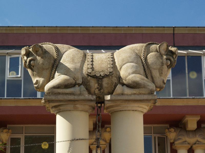 London, England: Harmony House (Baden Powell Close, Dagenham): bulls at top of columns (2000, architect F Alexander-Sefre, bull design by Tim Crawley of Rattee and Kett)