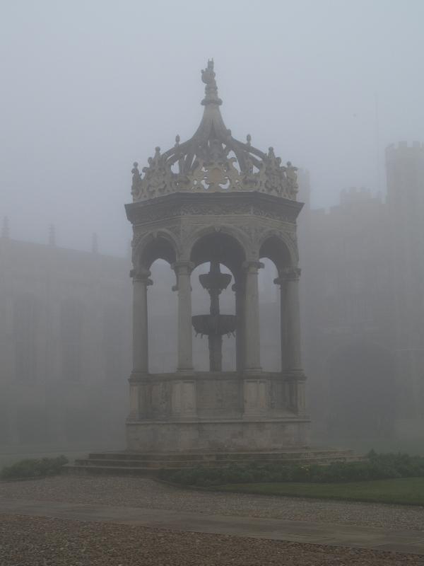 Cambridge, England: Trinity College: Great Court fountain in fog