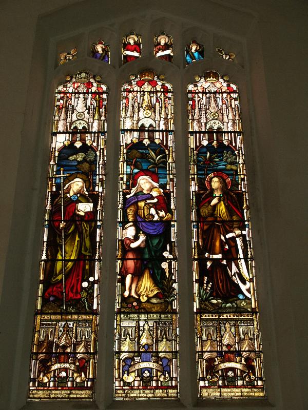 Cambridge, England: St Botolph's Church: north aisle north window (1888, Faith, Charity and Hope, painted by R.R. Vyvyan)