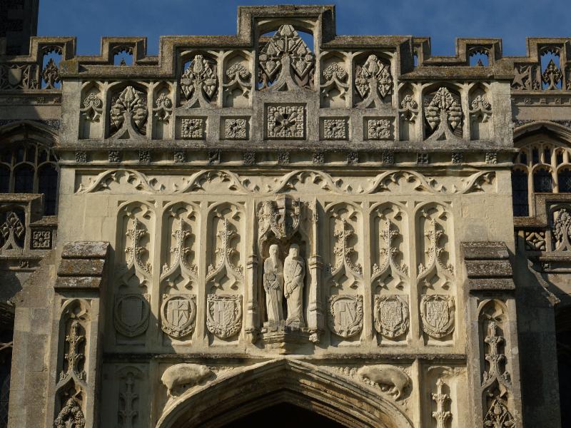 Lavenham, England: St Peter and St Paul Church: decoration over entrance (15th century)