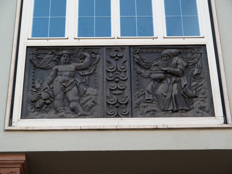 Frankfurt, Germany: Salzhaus (Salt House, Roemerberg , 27): wood plaque below window (one in series of the four seasons) (1610, so not destroyed in WWII)