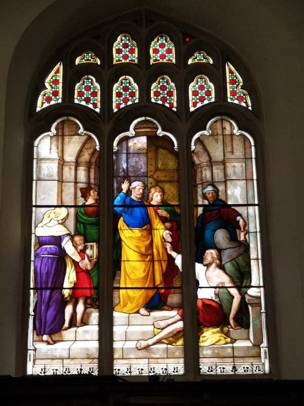 Cambridge, England: Peterhouse: chapel stained glass window, St Peter and blind beggar (1850s, overall design by Max Emanuel Ainmiller, figures largely work of Claudius Schraudolph and Heinrich von Hess, Royal School of Glass Painting, Munich)