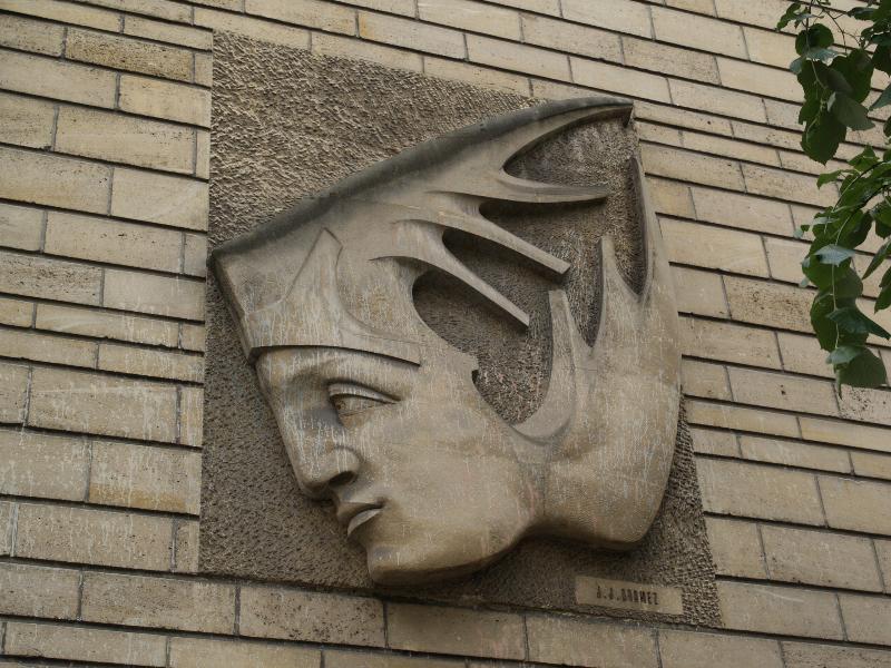 Paris, France: IME Notre Ecole, 43 Rue Falguiere: relief of face