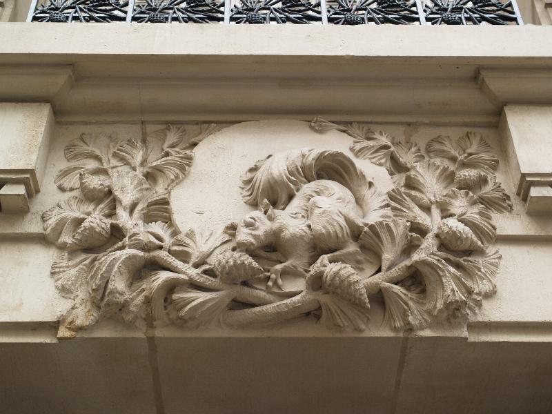 Paris, France: 20 Rue Raynouard: squirrel eating pine cones, decoration over door (1913, sculptor Mourgues, architect Albert Veque)