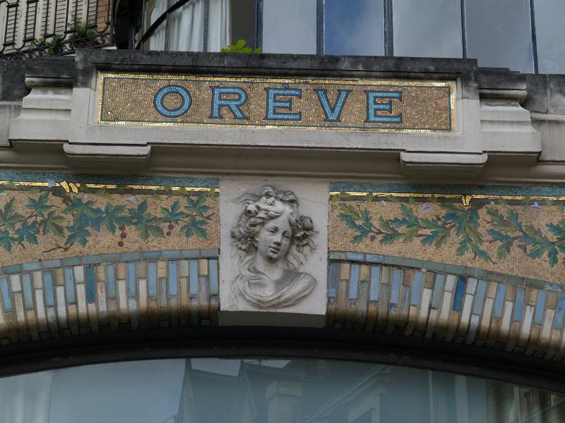 Paris, France: Oreve, 25 Rue de la Pompe: mosaic and sculpture over window (1911, architect Lecourtois)
