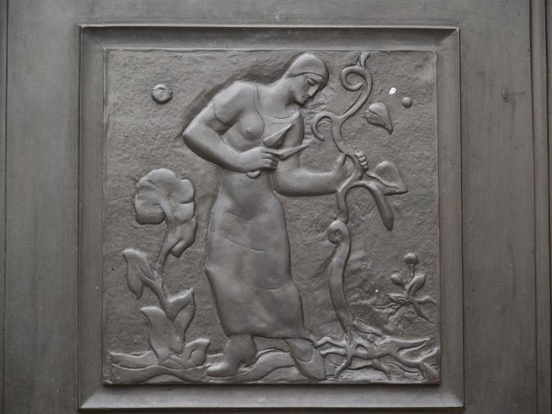 Cambridge, England: Guildhall: woman tending crops (1933, sculptor Gertrude Hermes)