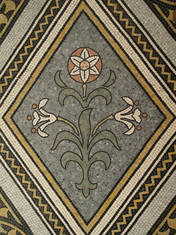Cambridge, England: Corpus Christi College: chapel, tiled floor, lily (1870, architect Arthur Blomfield)