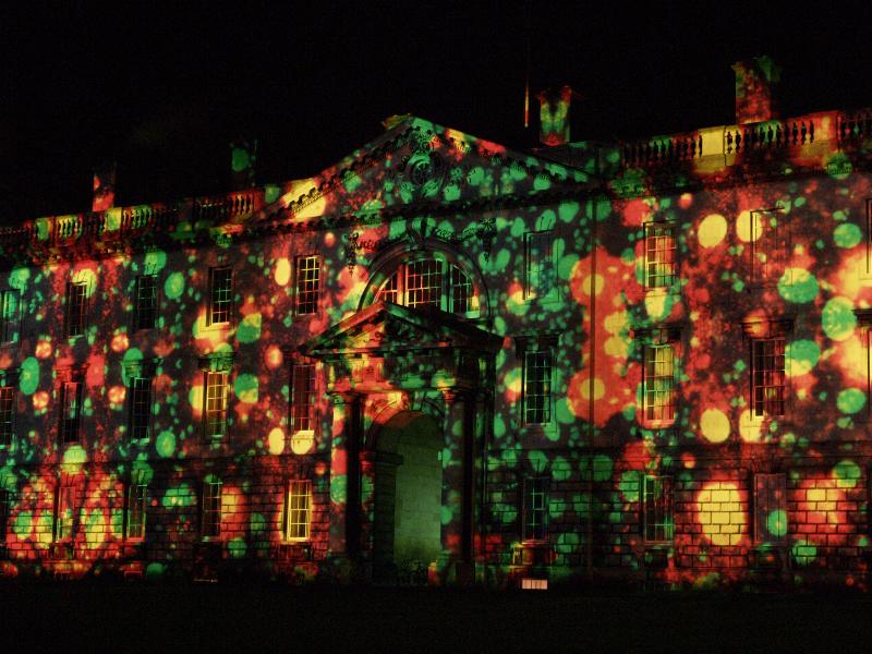 Cambridge, England: Gibbs Building: light show: orange and green blobs (Cambridge University 800th anniversary light show, officially 16-18 January 2010, light artist Ross Ashton)
