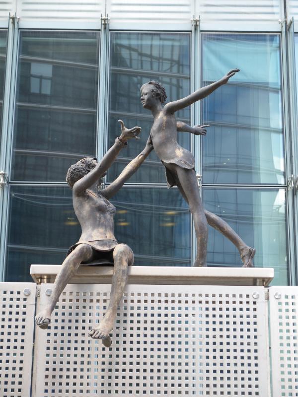 Brussels, Belgium: EU Charlemagne building: girls playing (1998, sculptor Rene Julien)