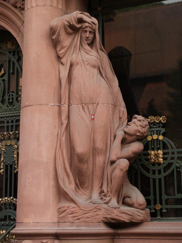 Heidelberg, Germany: Universitaet Heidelberg, Universitaetsbibliothek: female sculpture at right of door (1901-1905, architect Josef Durm)