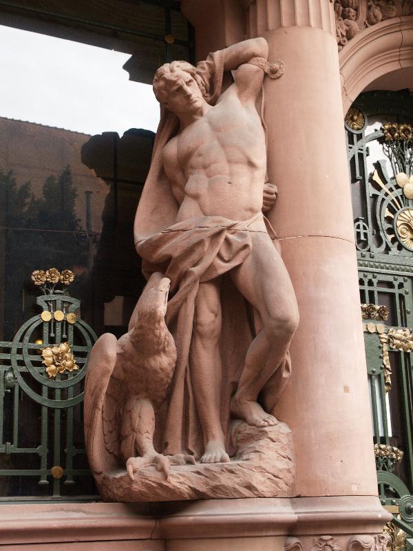 Heidelberg, Germany: Universitaet Heidelberg, Universitaetsbibliothek: male sculpture at left of door (Hercules?) (1901-1905, architect Josef Durm)