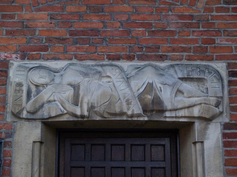 Munster, Germany: Alter Steinweg, Krameramtshaus: relief over door (1953)