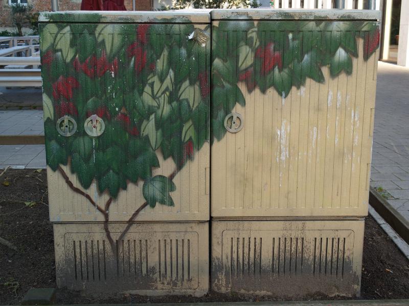 Munster, Germany: Koenigsstrasse: leaves painted on utility box