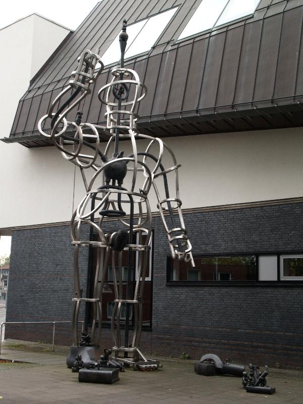Munster, Germany: City Library (Stadtbucherei): Superwoman (1993, Tom Otterness)