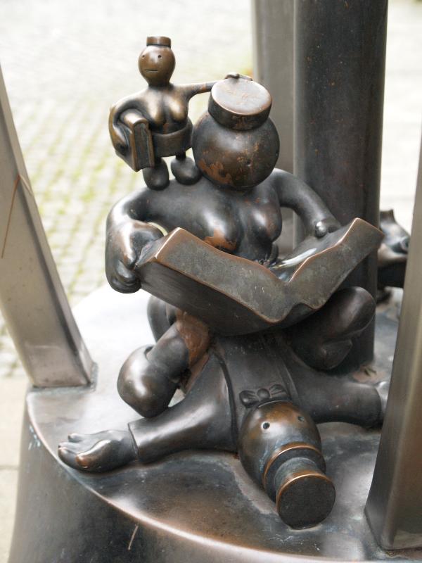 Munster, Germany: City Library (Stadtbucherei): figure detail, Superwoman (1993, Tom Otterness)