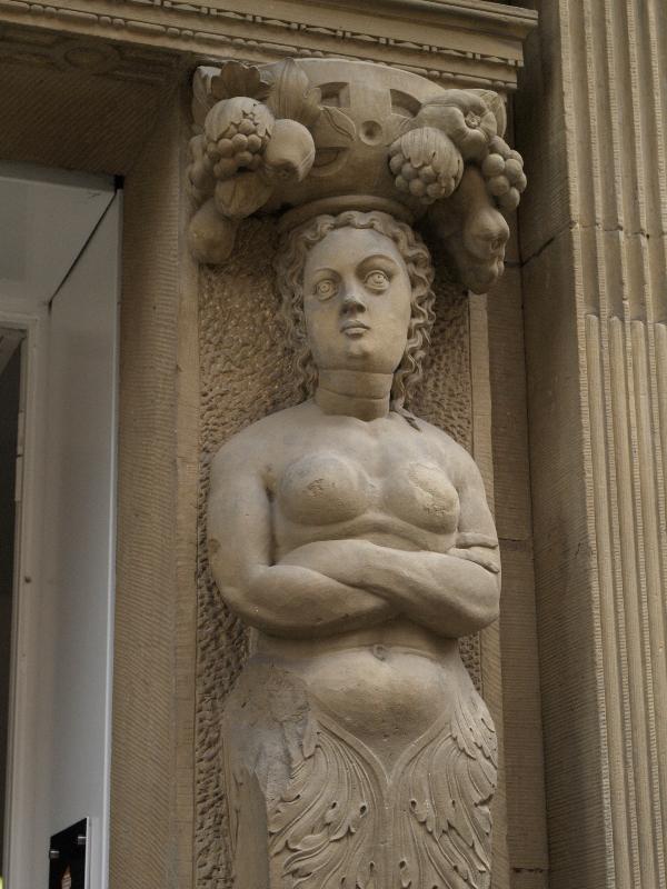 Munster, Germany: Roggenmarkt 11: woman sculpture at entrance