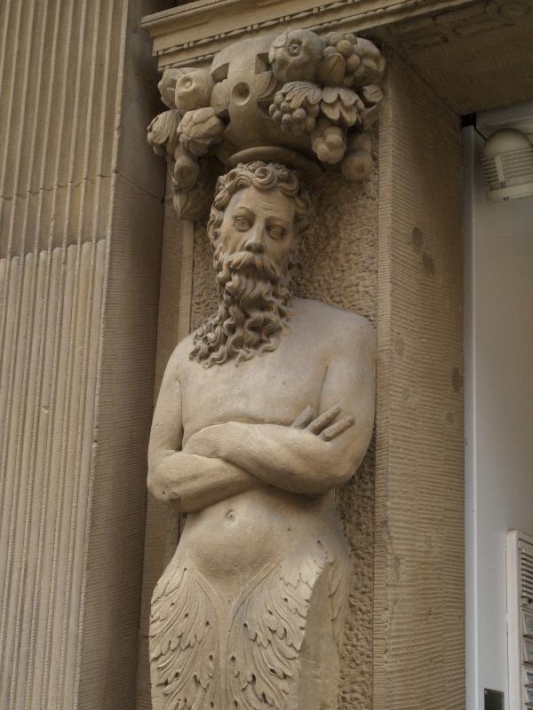 Munster, Germany: Roggenmarkt 11: man sculpture at entrance