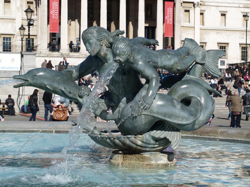 London, England: Trafalgar Square: west fountain mermaid and dolphin (1939, installed 1948, Charles Wheeler)