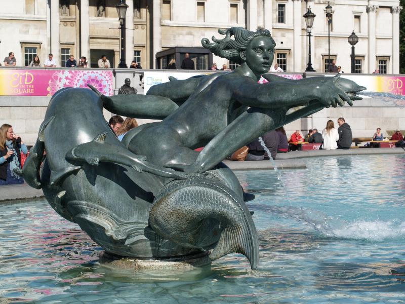 London, England: Trafalgar Square: east fountain mermaid and dolphins (1939, installed 1948, William McMillan)