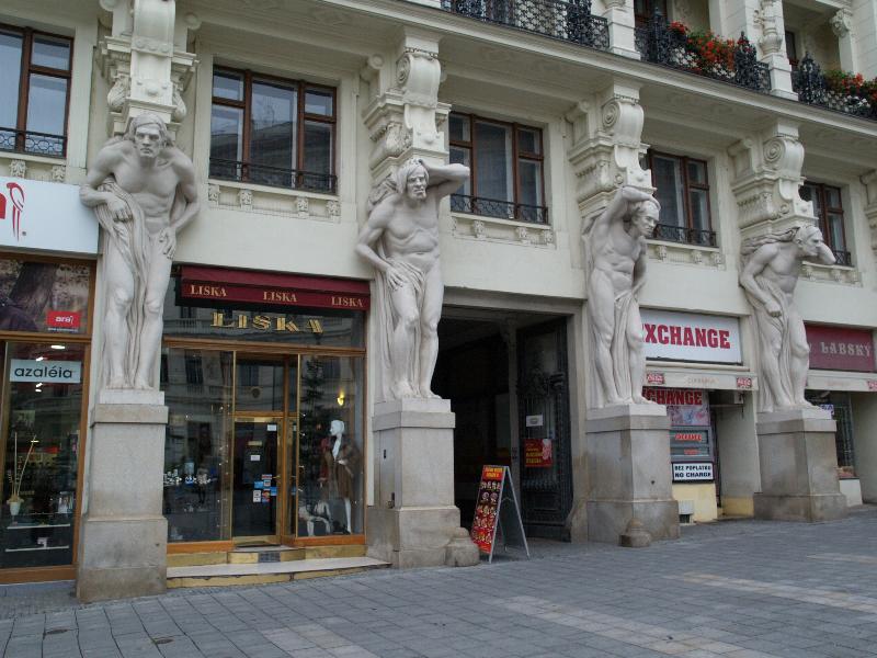 Brno, Czech Republic: Namesti Svobody (Freedom Square), Dum u ctyr mamlasu (House of the four idiots): four column supports (1901-1902, sculptor Antonin Tomola, architect Germano Wanderley)