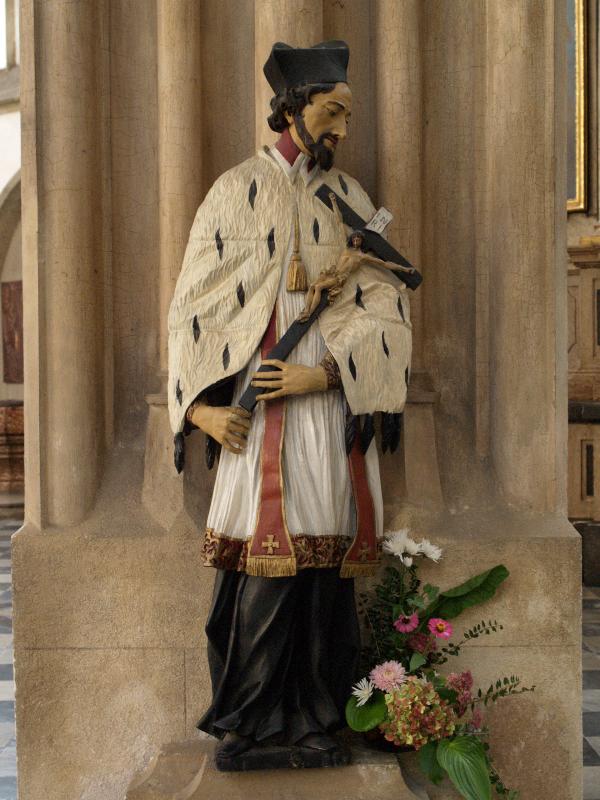 Brno, Czech Republic: Kostel sv. Jakuba (St James' Church): priest with crucifixion