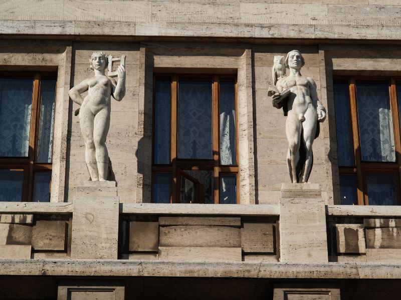 Prague, Czech Republic: Marianske namesti, Mestska knihovna v Praze (Municipal Library of Prague): central two of the six allegorical sculptures above entrance (1925-1928, sculptor Ladislav Kofranek, architect Frantisek Roith)
