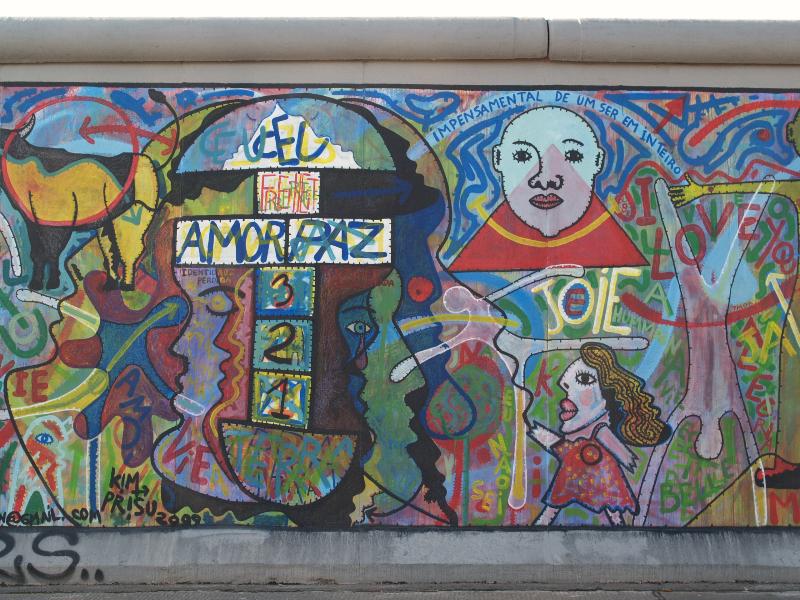 Berlin, Germany: East Side Gallery (Berlin Wall): Metamorphose des existences lie par un mobile indefini (2009, Kim Prisu, Joaquim A. Gocalves Borregana)