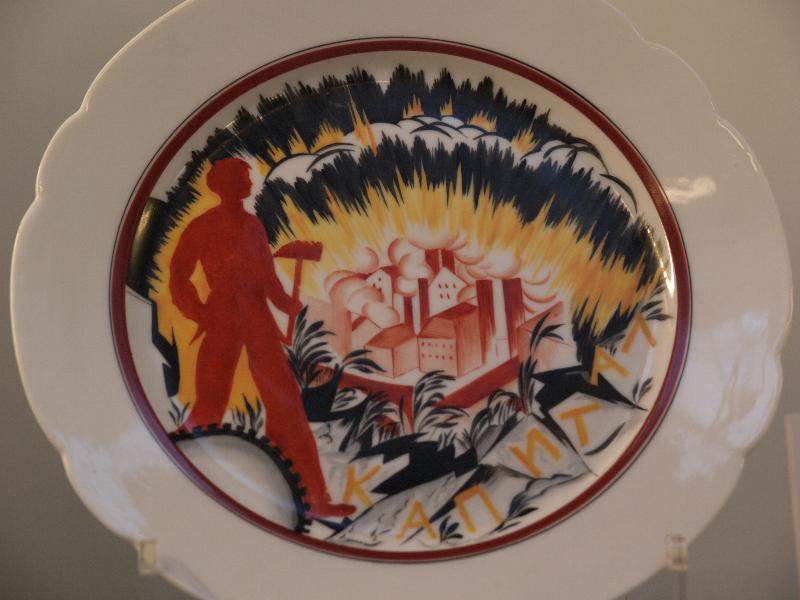 London, England: British Museum: porcelain plate, trampling Kapital (1921, decorated at the State Porcelain Factory, Petrograd, after a design by Mikhail Adamovich)