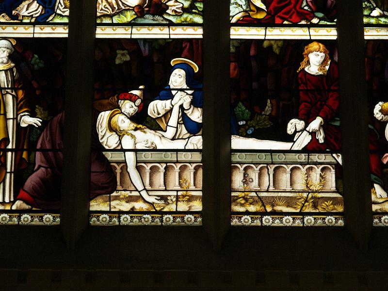 Cambridge, England: Corpus Christi College: chapel, east window detail, Christ laid in the tomb