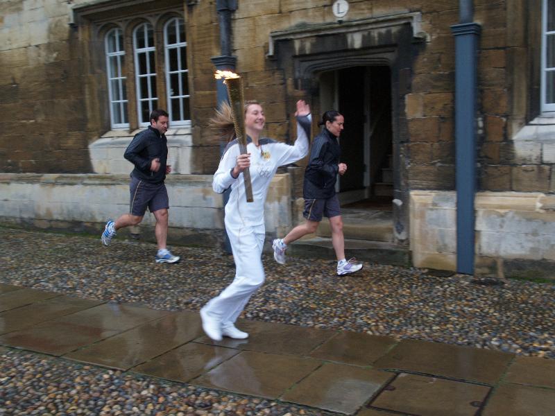 Cambridge, England: Trinity College: Olympic Torch Relay, Great Court, first torch bearer running