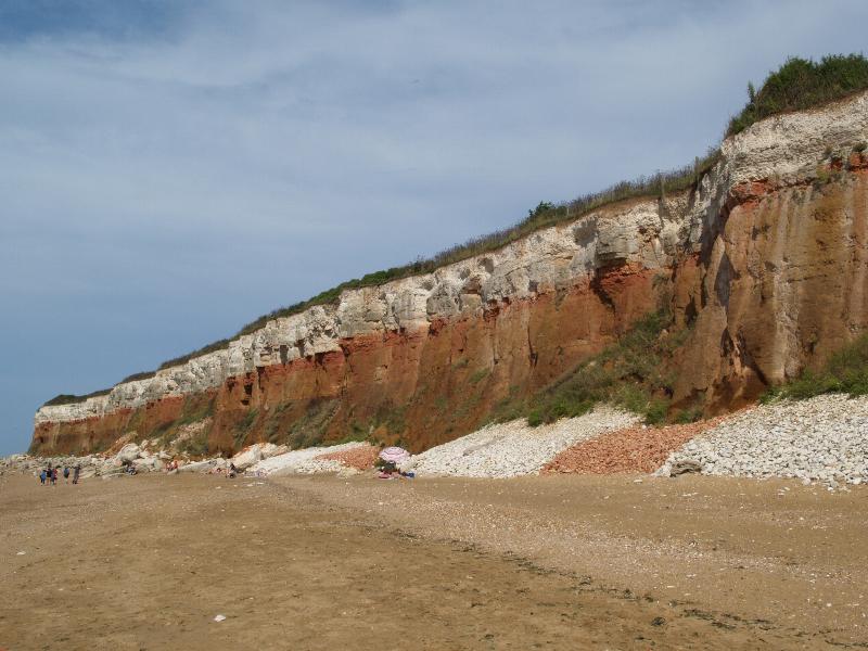 Hunstanton, England: beach: white, red and brown cliff