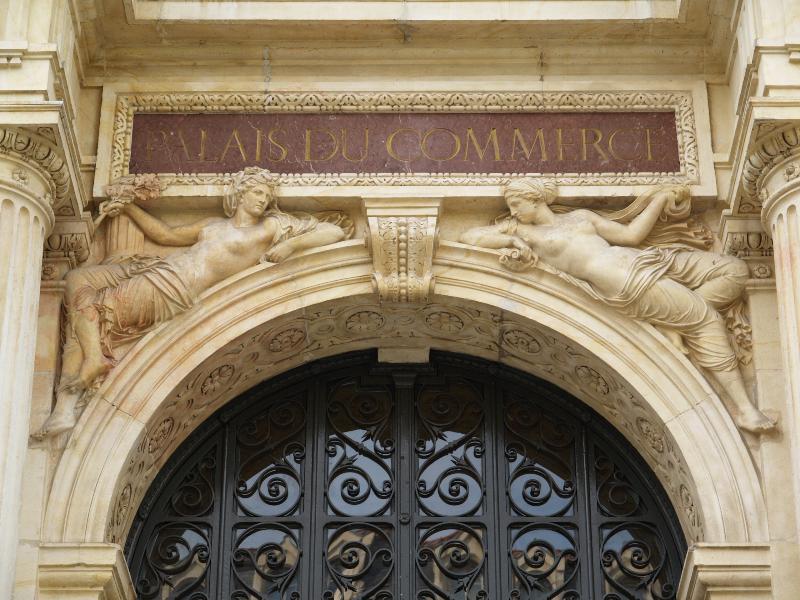 Lyon, France: Place de la Bourse, Palais du Commerce: two women over door (building 1856-1860, architect Rene Dardel)